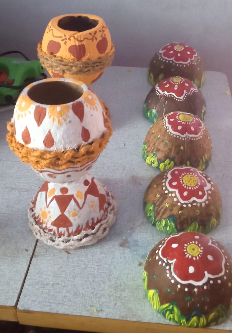 coconut shell flower wash bottom with warli art done by trainees